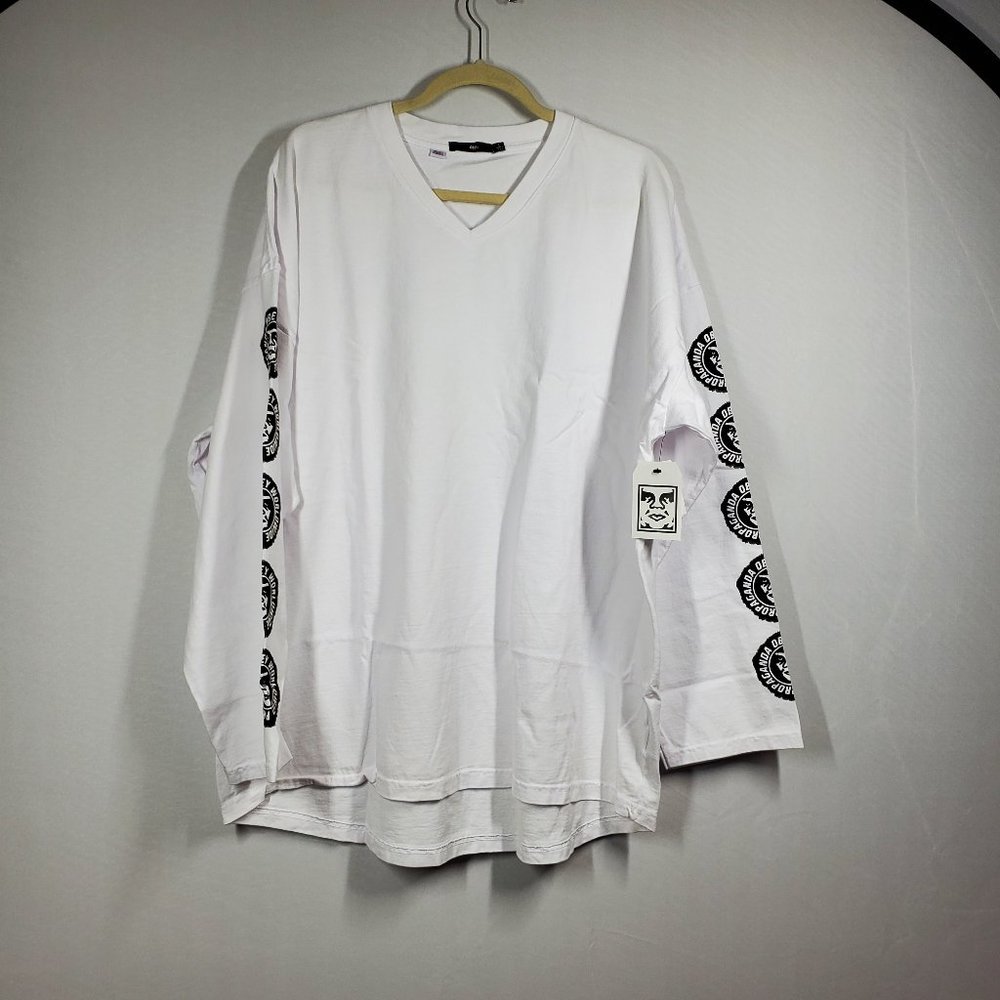 obey White t-shirt with image on the v-neck sleeves, size L